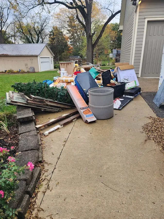 Dumpster being loaded with debris for 3 Yard Dumpster Rental in Springboro